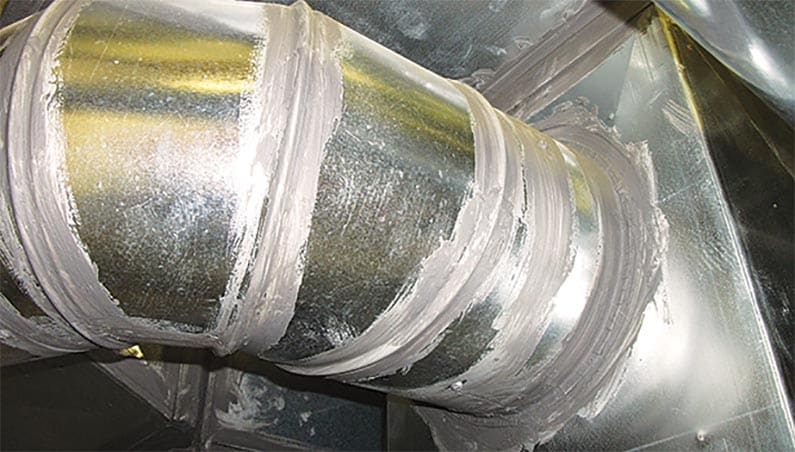hvac duct with a sealant on the cracks