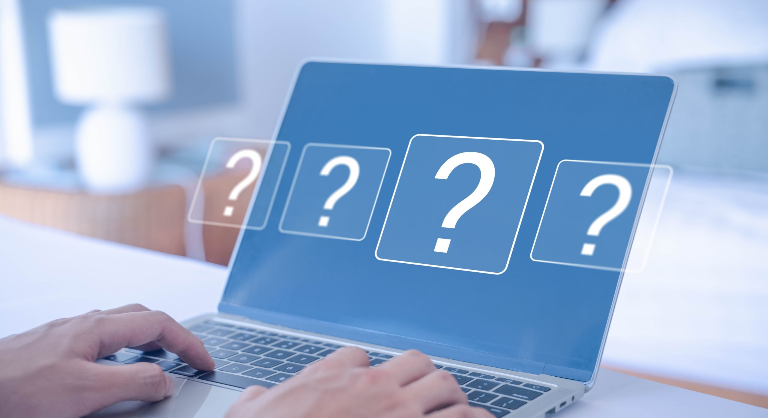 laptop with question marks on it