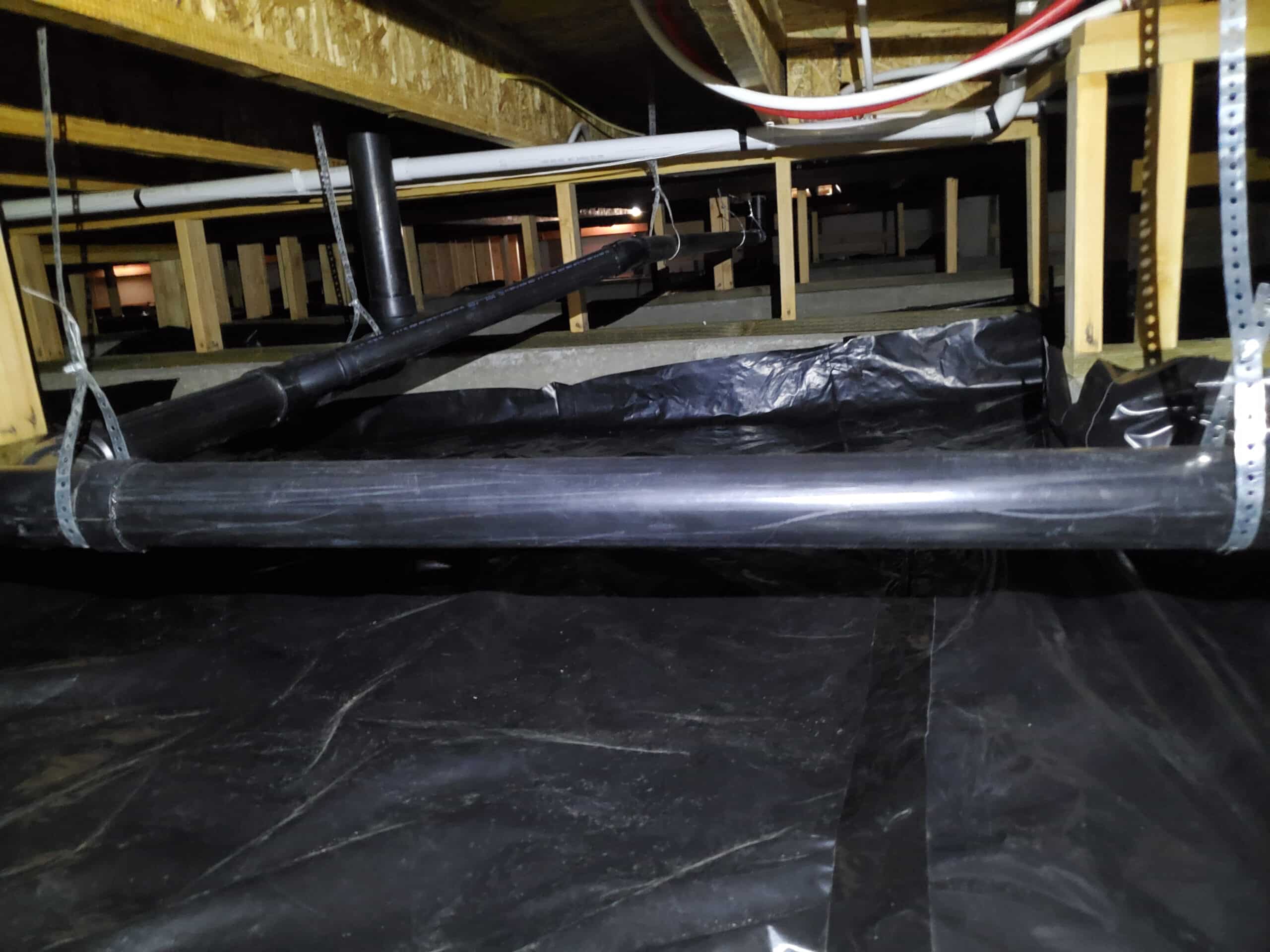 crawlspace with a new vapor barrier added